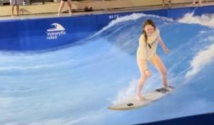 Mandy Jo is surfing in a pool. 